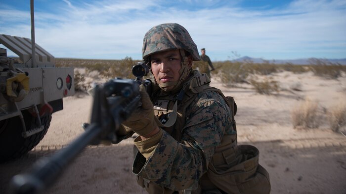 A Marine holds security during a route clearance drill as a part of Exercise Steel Knight at Marine Corps Air Ground Combat Center Twentynine Palms, California, Dec. 13, 2015. The Marine is with 1st Combat Engineer Battalion. During route clearance Marines use a variety of vehicles to search for improvised explosive devices, mines and other dangerous obstructions. Steel Knight is a 1st Marine Division led exercise, which enables the Marines and sailors to operate in a realistic environment to develop skill sets necessary to maintain a fully capable Marine Air Ground Task Force.