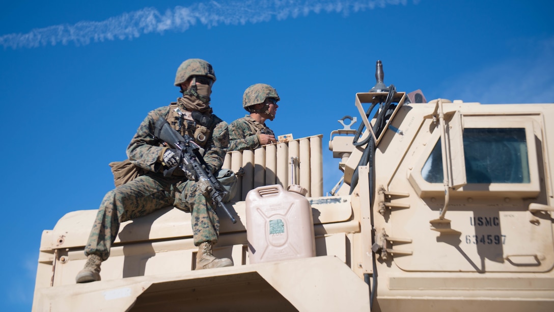 Marines hold security during maintenance on a mine resistant ambush-protected vehicle as a part of Exercise Steel Knight at Marine Corps Air Ground Combat Center Twentynine Palms, California, Dec. 12, 2015. The Marines are with 1st Combat Engineer Battalion. During route clearance Marines use a variety of vehicles to search for improvised explosive devices, mines and other dangerous obstructions. Steel Knight is a 1st Marine Division led exercise, which enables the Marines and sailors to operate in a realistic environment to develop skill sets necessary to maintain a fully capable Marine Air Ground Task Force.