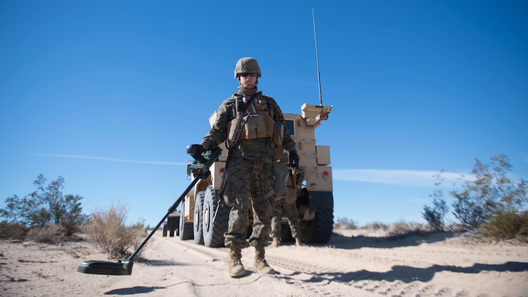 A Marine scans for improvised explosive devices during Exercise Steel Knight at Marine Corps Air Ground Combat Center Twentynine Palms, California, Dec. 13, 2015.  The Marines are with 1st Combat Engineer Battalion. During route clearance Marines use a variety of vehicles to search for improvised explosive devices, mines and other dangerous obstructions. Steel Knight is a 1st Marine Division led exercise, which enables the Marines and sailors to operate in a realistic environment to develop skill sets necessary to maintain a fully capable Marine Air Ground Task Force.