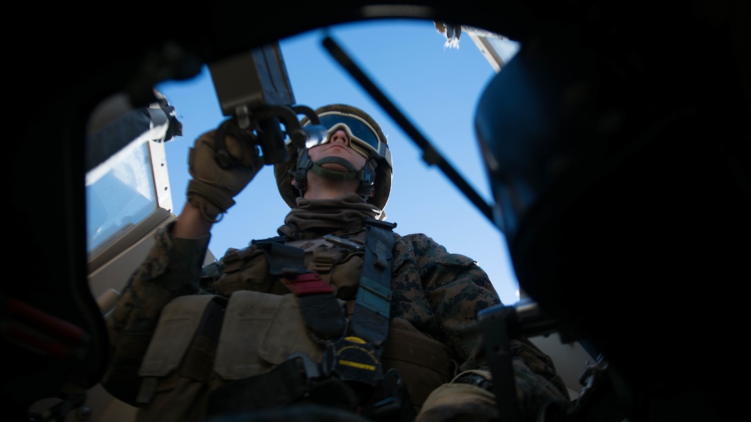 A Marine scans for improvised explosive devices and enemies from the turret of a mine resistant ambush-protected vehicle during Exercise Steel Knight at Marine Corps Air Ground Combat Center Twentynine Palms, California, Dec. 12, 2015. The Marines are with 1st Combat Engineer Battalion. During route clearance Marines use a variety of vehicles to search for improvised explosive devices, mines and other dangerous obstructions. Steel Knight is a 1st Marine Division led exercise, which enables the Marines and sailors to operate in a realistic environment to develop skill sets necessary to maintain a fully capable Marine Air Ground Task Force.