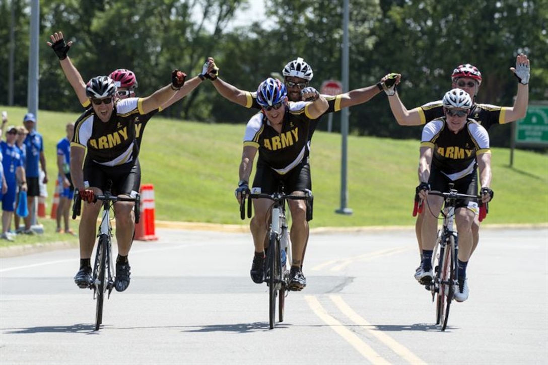 Army visually impaired cycling teams finish together to take gold, silver and bronze medals during the 2015 Department of Defense Warrior Games on Marine Corps Base Quantico, Virginia, June 21, 2015. The 2016 DoD Warrior Games are scheduled to take place at the U.S. Military Academy in West Point, New York, June 14-22. DoD photo by EJ Hersom