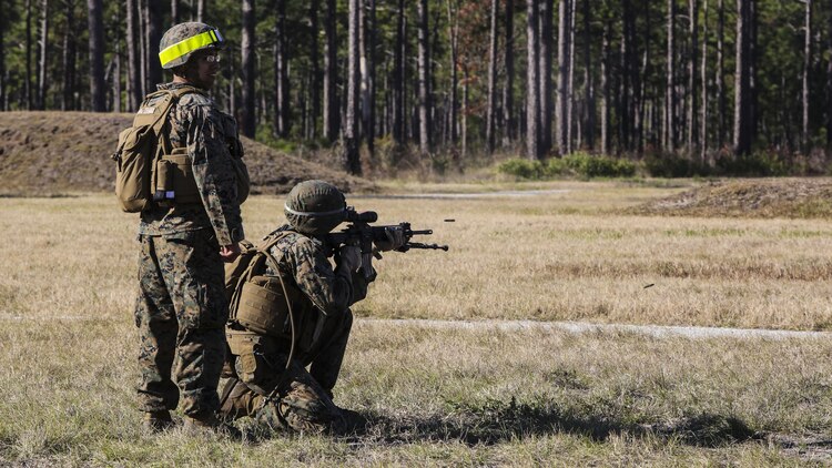 A Marine with 3rd Battalion, 6th Marine Regiment, fires on a target down range under the supervision of a position safety officer during a battalion exercise at Marine Corps Base Camp Lejeune, N.C., Dec. 10, 2015. The battalion-wide exercise reinforced basic infantry skills and brought junior Marines up to optimal operability across the companies. 