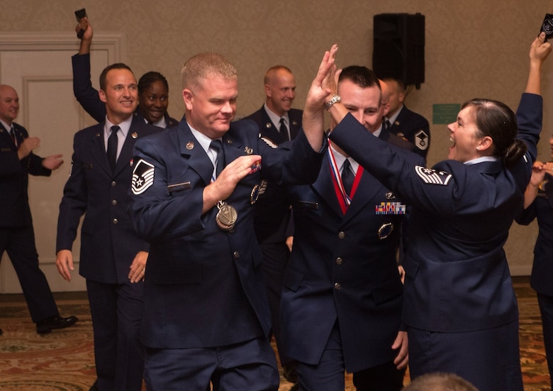 Master Sgt. Adam Eldard, left, celebrates with fellow recruiters as his name is announced as the Top Recruiter for Air Force Reserve Command Recruiting Service for FY 15 Nov. 5 at Warner-Robins Air Force Base, Ga. He met 235% of his annual goal. The recruiting zones for “Team Davis-Monthan include the greater Tucson, Ariz., area, and Holloman Air Force Base, N.M. (Courtesy photo)

