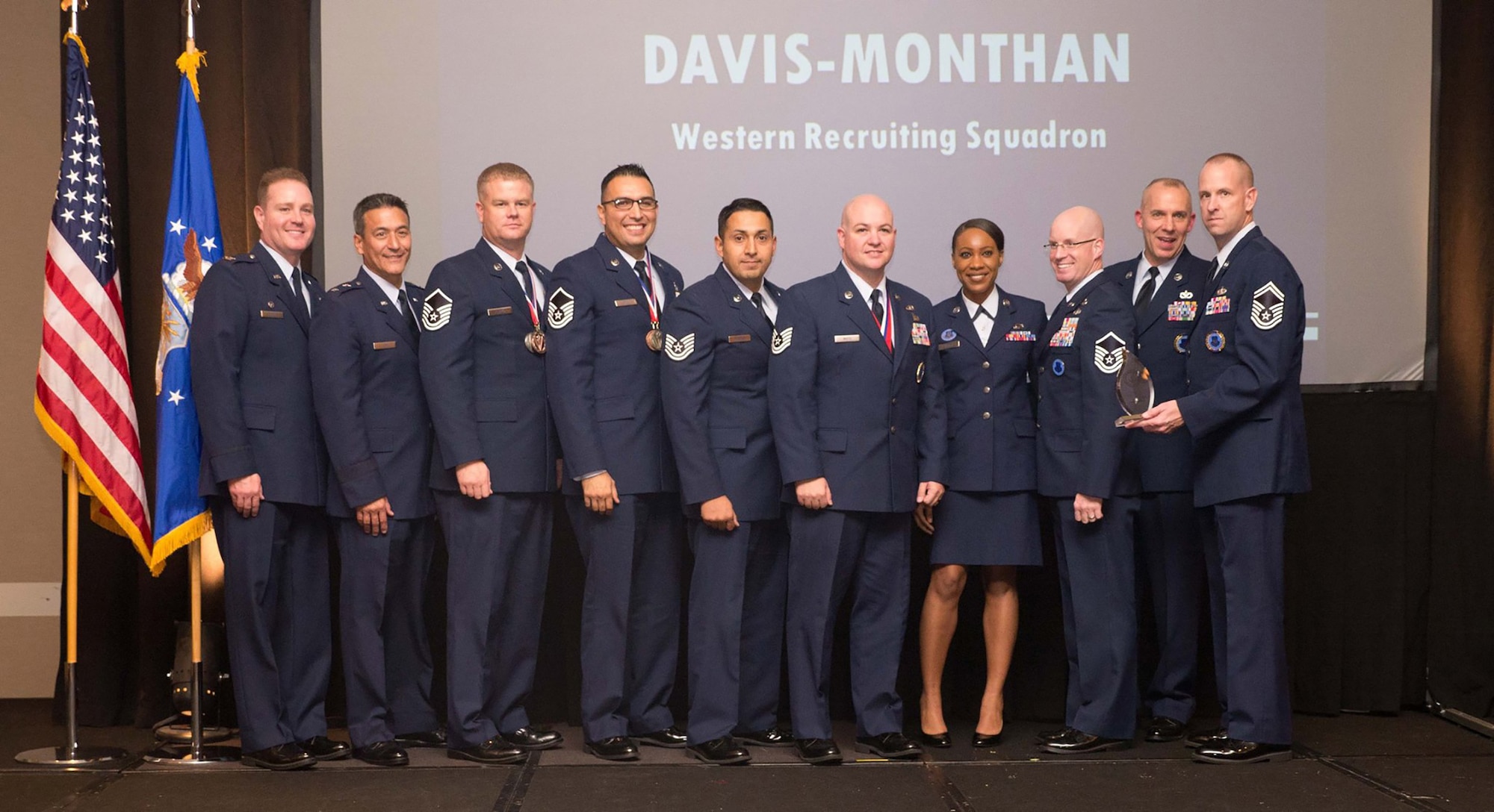 Recruiters from Davis-Monthan Air Force Base, Ariz., and Holloman Air Force Base, N.M., accept their award for the Top Flight in Air Force Reserve Command Recruiting Service for FY 1015Nov. 5 at Warner-Robins Air Force Base, Ga. They earned the award for having met 209% of their annual accessions goal. Their recruiting zone includes the greater Tucson, Ariz., and Southern N.M. areas. (Courtesy photo) 
