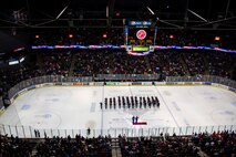 Marine Corps Poolees from Recruiting Sub-Station Grand Rapids South conduct a swear-in ceremony, led by Capt. Tracey Smith, Recruiting Station Lansing, Mich., executive officer, on the ice inside Van Andel Arena during the Grand Rapids Griffins hockey game, Dec. 9, 2015. According to Master Sgt. Kenneth Murillo, RS Lansing, RSS Grand Rapids South staff noncommissioned officer-in-charge, events like this are key in showing the Poolees they have their community’s support in their decision to join the United States Marine Corps and it helps keep them motivated. 