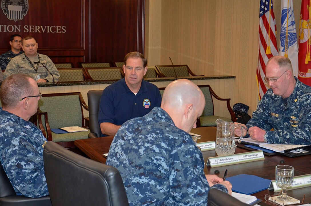 Addressing the integration of the military reserve personnel with the rest of his workforce as one of DLA Disposition Services’ greatest strengths, DLA Disposition Services Director Mike Cannon (center) meets with expeditionary workforce leaders. 