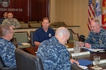 Addressing the integration of the military reserve personnel with the rest of his workforce as one of DLA Disposition Services’ greatest strengths, DLA Disposition Services Director Mike Cannon (center) meets with expeditionary workforce leaders. 