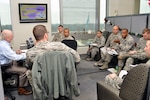 Dave Herrick, left, trains the Air Force’s 436th Logistics Readiness Squadron on the Defense Logistics Agency Energy’s mission at the McNamara Headquarters Complex, Fort Belvoir, Virginia, Dec. 9.