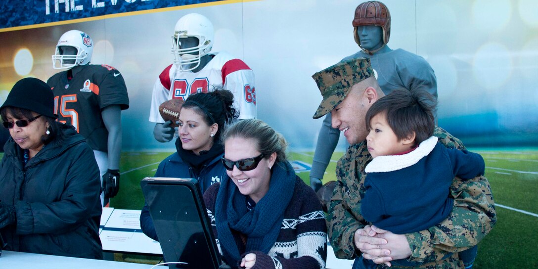 Marines and their families visit the Salute to Service Tour Nov. 23 aboard Marine Corps Base Quantico hosted by USSA, the Military Sponsor of the NFL. Servicemembers and their families had the unique opportunity to see this year’s Vince Lombardi Trophy. 