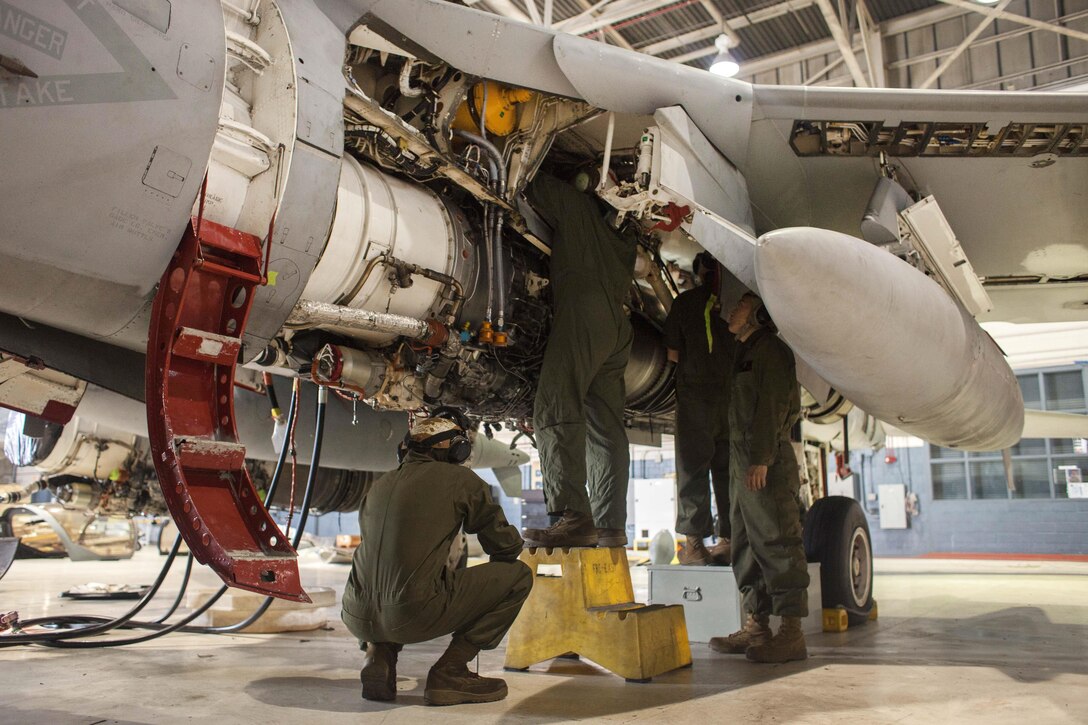 Marines perform maintenance on an EA-6B Prowler engine on Marine Corps Air Station Cherry Point, N.C., Dec. 1, 2015. U.S. Marine Corps photo by Lance Cpl. Jered T. Stone