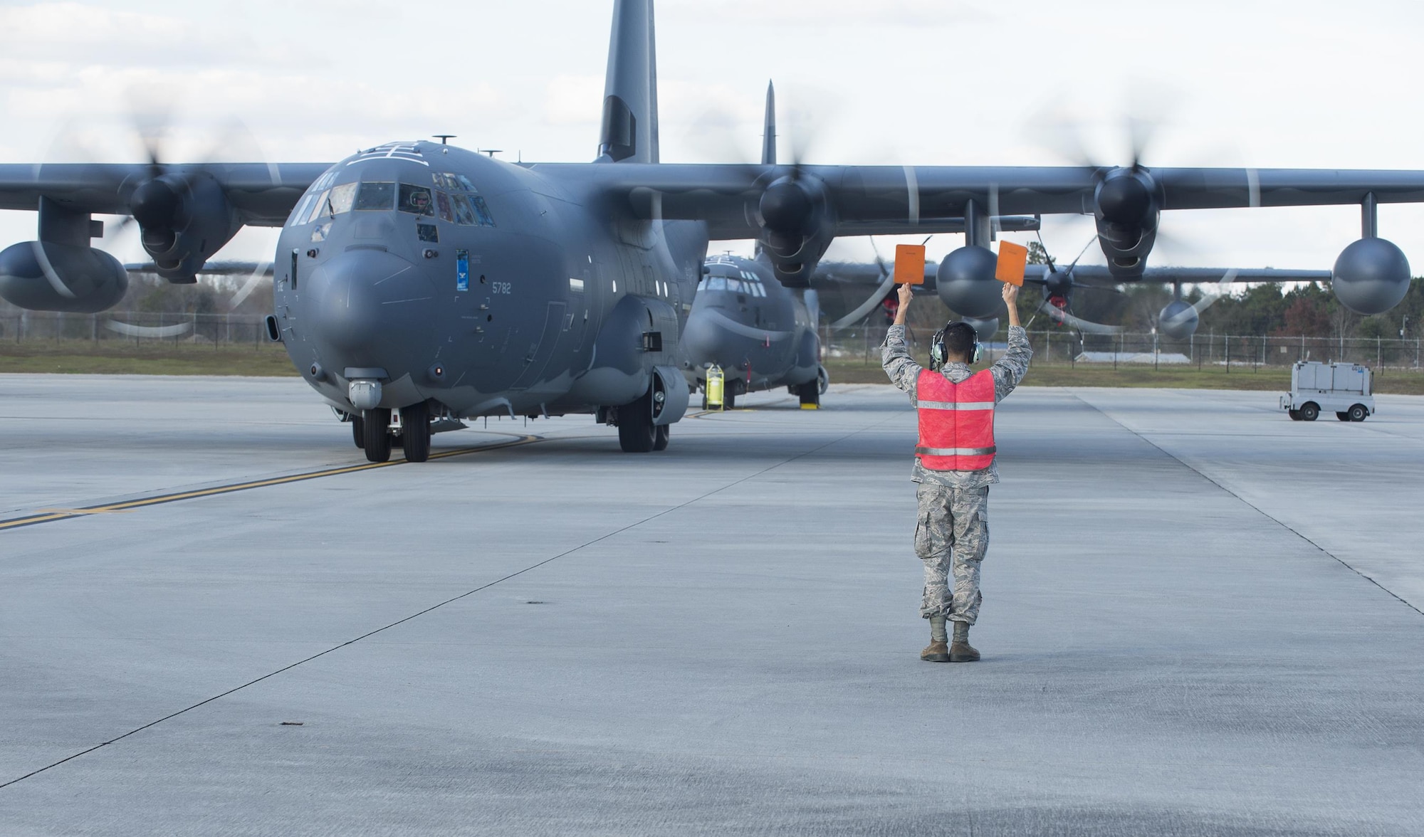 Airman 1st Class Jonathan Marquez, a 71st Rescue Squadron crew chief, marshals in an HC-130J Combat King II Dec. 11, 2015, at Moody Air Force Base, Ga. The aircraft is the 2,500th C-130 manufactured by Lockheed Martin Corp. in Marietta, Ga. (U.S. Air Force photo/Senior Airman Ceaira Tinsley)