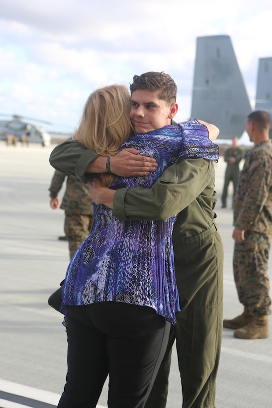 Friends and family welcome home a Marine with Marine Medium Tiltrotor Squadron (VMM) 161 aboard Marine Corps Air Station Miramar, Calif. Dec. 13. Marines with VMM-161 deployed for seven months as the aviation combat element of the 15th Marine Expeditionary Unit. (U.S. Marine Corps photo by Lance Cpl. Harley Robinson/Released)