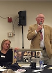 Dale Costill speaks to nearly 200 family members about his brother, who was lost during World War II in Pearl Harbor. Costill, looking for answers, attended a government briefing hosted by the Defense POW/MIA Accounting Agency, in Portland, Maine, Nov. 14