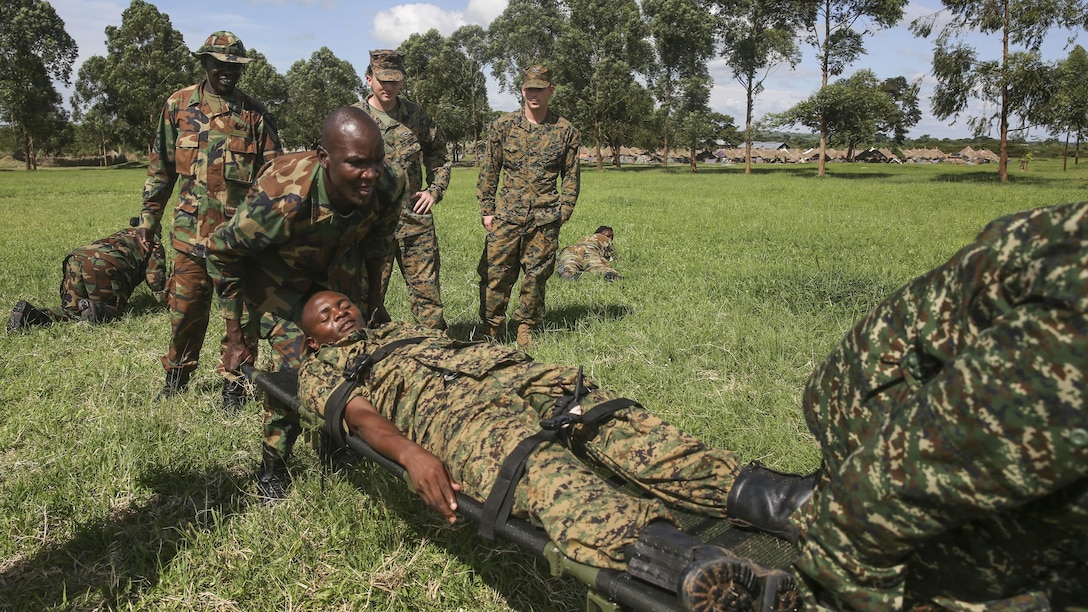 Uganda People’s Defense Force soldiers carry a notional injured soldier to a safe area during a tactical combat casualty care exercise at Camp Singo, Uganda, Nov. 30, 2015. The UPDF medics and U.S. Navy corpsmen with Special-Purpose Marine Air-Ground Task Force Crisis Response-Africa, are training together to improve tactical medical care skills while strengthening the bond between the partner nations. 