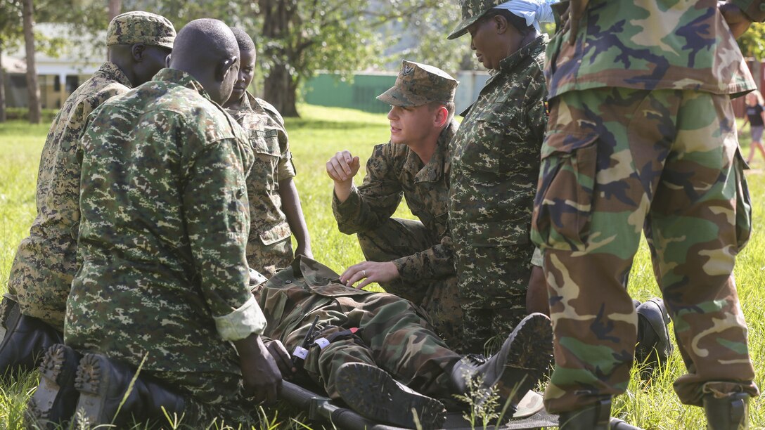 Petty Officer 3rd Class Paxton Dowd, corpsman with Special-Purpose Marine Air-Ground Task Force Crisis Response-Africa, instructs Uganda People’s Defense Force medics during a tactical combat casualty care exercise at Camp Singo, Uganda, Nov. 30, 2015. The UPDF medics and corpsmen are training together to improve tactical medical care skills while strengthening the bond between the partner nations. 