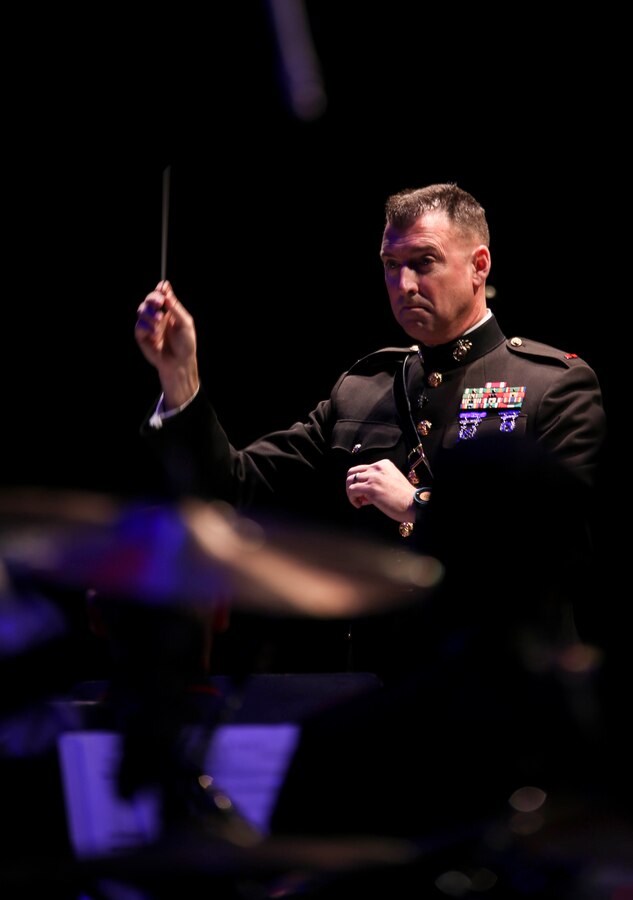 CW 3 Michael J. Smith, principal conductor for Marine Corps Band New Orleans, conducts his Marines during their holiday performance “Santa Meets Sousa” at Saenger Theater in New Orleans, Louisiana on Dec. 11, 2015. The performance was part of their yearly Toys for Tots tour, where they accepted new, unwrapped toys from audience members to give to less fortunate children during the holiday season.