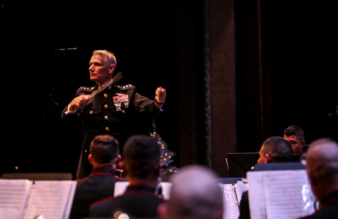 Lt. Gen. Rex C. McMillian, commander of Marine Forces Reserve, takes charge of conducting the Marine Corps Band New Orleans during their “Santa Meets Sousa” holiday concert at Saenger Theater in New Orleans, Louisiana on Dec. 11, 2015. This is the 10th year the Marine Corps Band New Orleans has performed in the Toys for Tots Concert production tour. 