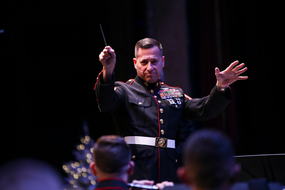 Sgt. Maj. Anthony Spadaro, sergeant major of Marine Forces Reserve, conducts the Marine Corps Band New Orleans, during their “Santa Meets Sousa” holiday performance at Saenger Theater in New Orleans, Louisiana on Dec. 11, 2015. This is the 10th year the Marine Corps Band New Orleans has performed in the Toys for Tots Concert production tour. 
