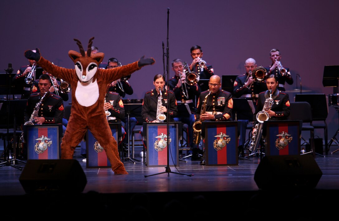 Rudolph joins Marine Corps Band New Orleans on stage at Saenger Theater in New Orleans, Louisiana on Dec. 11, 2015. The band conducted their holiday performance “Santa Meets Sousa.” The performance was part of their yearly Toys for Tots tour, where they accepted new, unwrapped toys from audience members to give to less fortunate children during the holiday season. 