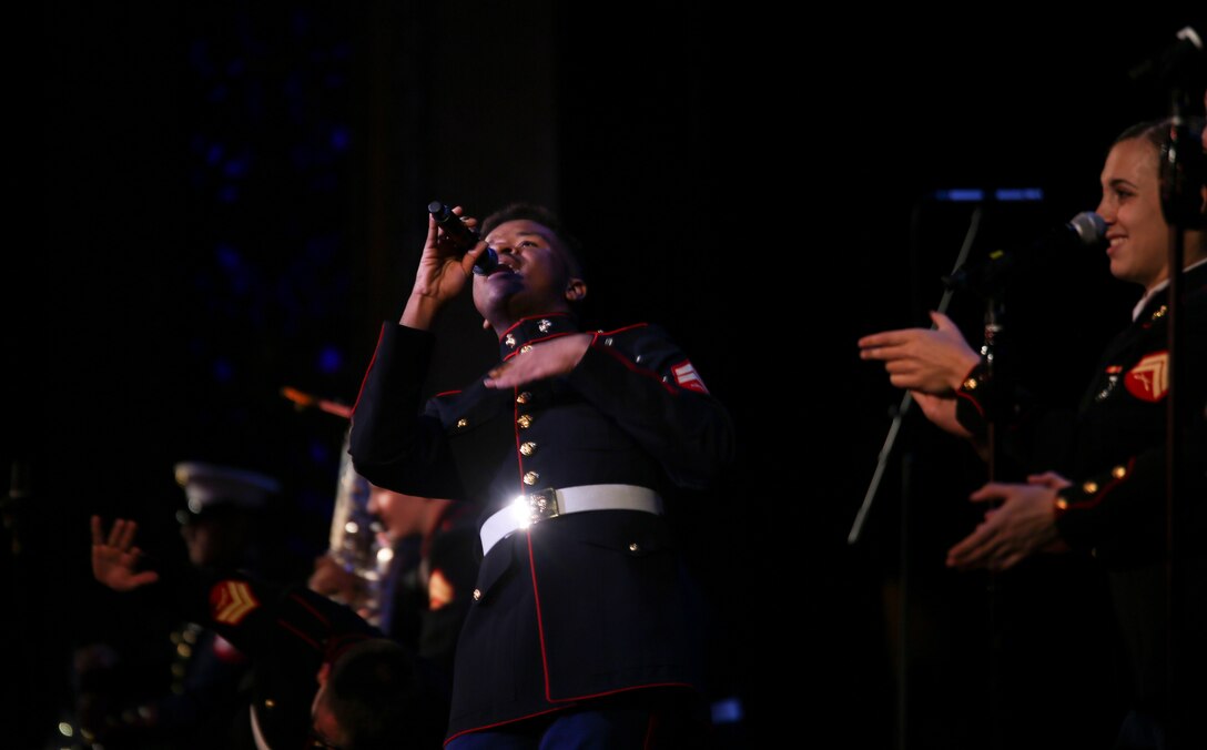 Cpl. Adam Chandler, a singer and clarinet player with Marine Corps Band New Orleans, performs for the crowd during their holiday concert, “Santa Meets Sousa,” at Saenger Theater in New Orleans, Louisiana on Dec. 11, 2015. This is the 10th year the Marine Corps Band New Orleans has performed in the Toys for Tots Concert production tour. 
