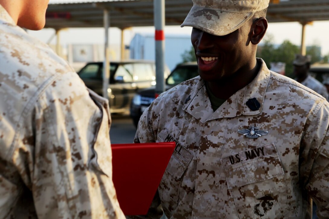 U.S. Navy Petty Officer 2nd Class Ambrose McGill, a hospital corpsman with Special Purpose Marine Air Ground Task Force—Crisis Response—Central Command, receives his Fleet Marine Force pin during a recognition ceremony at an undisclosed location in Southwest Asia, Dec. 12, 2015. The FMF pin is a prideful achievement for Sailors and upon earning the pin, shows the Sailor has gone above and beyond his required duties. (U.S. Marine Corps photo by Sgt. Owen Kimbrel/RELEASED)