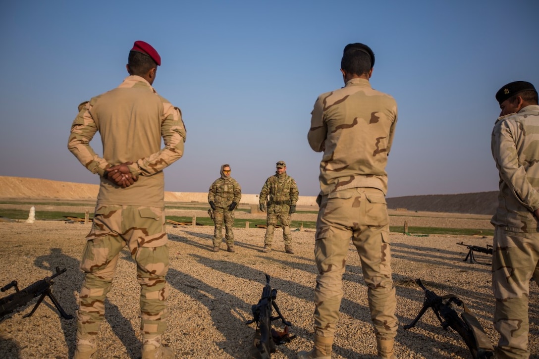 Royal Danish Army soldiers 1st Lt. Kristine and Sgt. 1st Class Martin, both with the building partner capacity (BPC) mission, conduct a safety brief before training Iraqi soldiers with the 3rd Battalion, 75th Brigade, 7th Iraqi Army Division, at Al Asad Air Base, Iraq, Nov. 27, 2015. Weapons conditions, weapons handling and safety rules are taught and recited before each training evolution. Training at the BPC sites focuses on basic combat skills and includes: military tactics, instruction in leadership, ethics, the law of war, land navigation, battlefield medicine, counter-sniper tactics, explosive hazard awareness training, infantry skills, small unit maneuvering and combined arms obstacle breaching.  (U. S. Marine Corps photo by Lance Cpl. Clarence Leake/Released)
