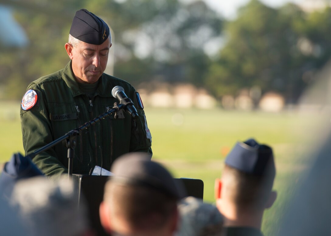 French Air Force Brig. Gen. Phillip Lavigne speaks during a wreath laying ceremony at Joint Base Langley-Eustis, Va., Dec. 11, 2015. The ceremony was held during the inaugural Trilateral Exercise, which involved service members from the U.S. Air Force, British Royal Air Force and French Air Force and was hosted by the 1st Fighter Wing. U.S. Air Force photo by Airman 1st Class Derek Seifert