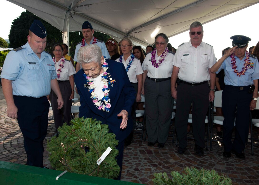 Civil Air Patrol Col. Mary Feik lays a wreath in honor of all U.S. prisoners of war and missing personnel during a wreath-laying ceremony as part of Wreaths Across America at the National Memorial Cemetery of the Pacific in Honolulu, Dec. 12, 2015. The wreath laying is held annually, on the second or third Saturday of December, at more than 1,000 cemeteries across the country and honors fallen service members, prisoners of war, the missing in action and all active duty service members. U.S. Navy photo by Petty Officer 2nd Class Jeff Troutman