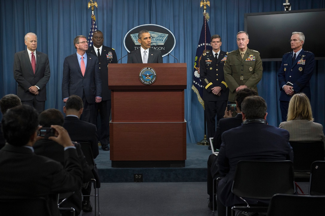 President Barack Obama speaks to reporters after meeting with his National Security Council about the fight against the Islamic State of Iraq and the Levant, or ISIL, as Defense Secretary Ash Carter, second from left, stands at his side at the Pentagon, Dec. 14, 2015, Vice President Joel Biden, far left, and Marine Corps Gen. Joseph F. Dunford Jr., right, chairman of the Joint Chiefs of Staff, look on. DoD photo by Air Force Senior Master Sgt. Adrian Cadiz