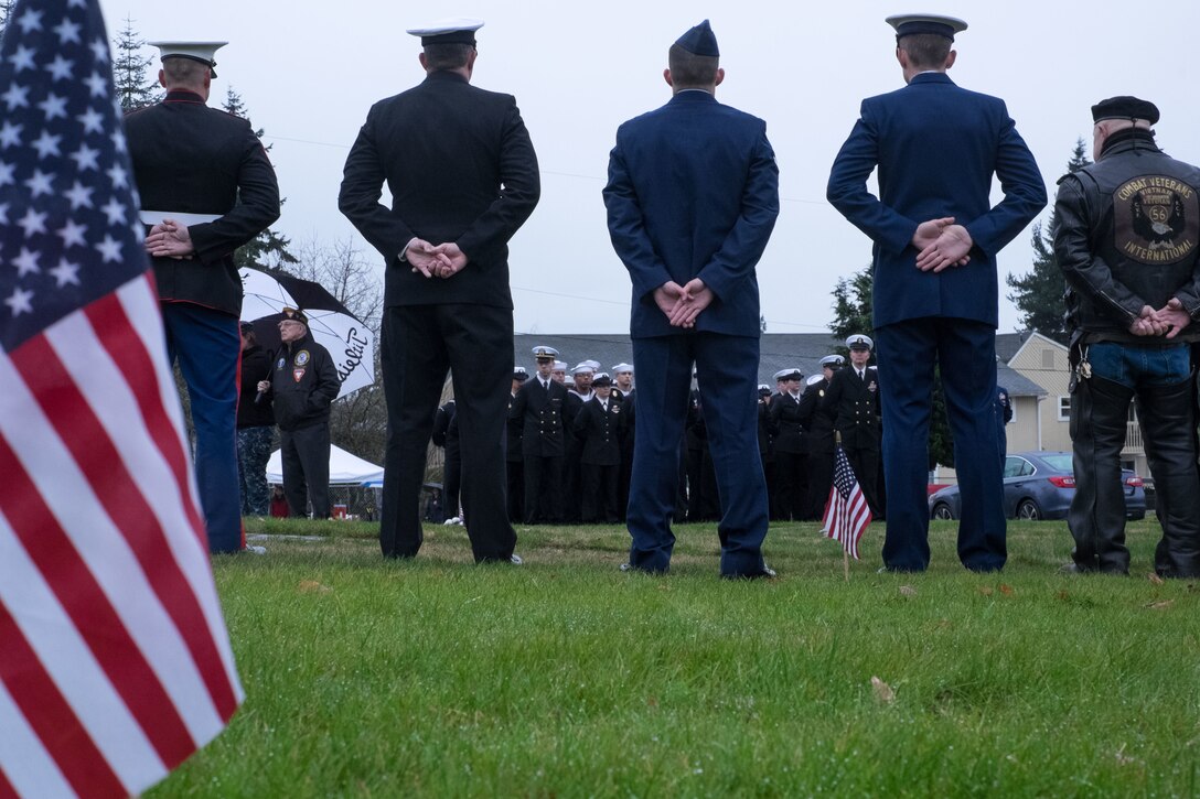 Service members and a veteran stand at parade rest during the Wreaths Across America wreath-laying ceremony at Ivy Green Cemetery in Bremerton, Wash., Dec. 12, 2015. U.S. Navy photo by Petty Officer 3rd Class Seth Coulter