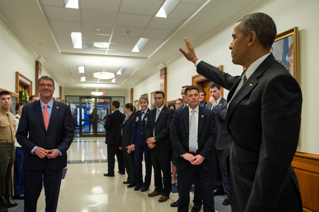 President Barack Obama waves goodbye after meeting with Defense Secretary Ash Carter, left, and the National Security Council at the Pentagon, Dec. 14, 2015, about the fight against the Islamic State of Iraq, or ISIL. DoD photo by Air Force Senior Master Sgt. Adrian Cadiz