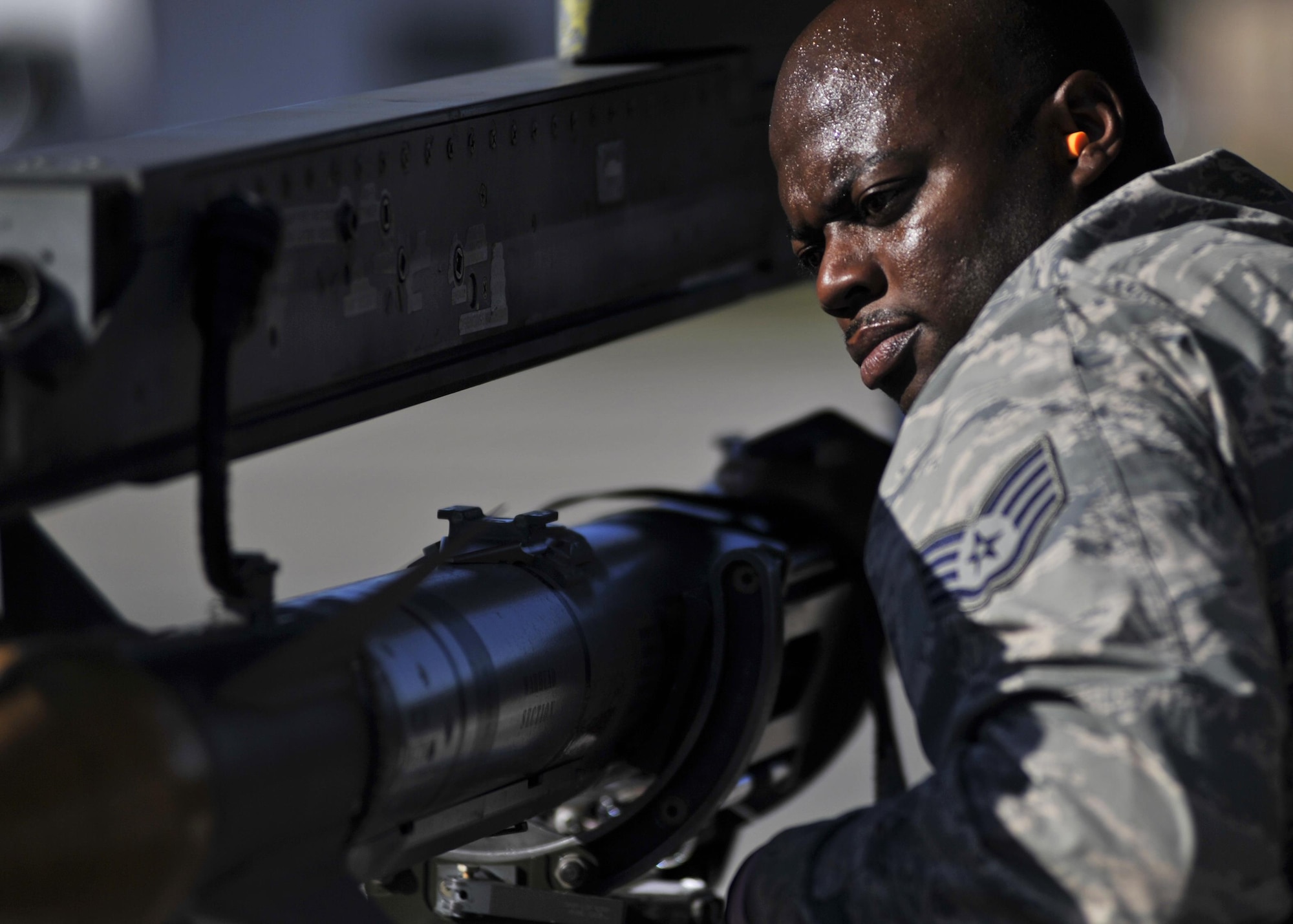 An aircraft armament Airman with the 77th Aircraft Maintenance Unit at Shaw Air Force Base, S.C., begins to unload a missile Dec. 8, 2015, on the flightline at Tyndall AFB, Fla. Airmen from Shaw were at Tyndall for the 53rd Weapons Evaluation Group’s Weapons System Evaluation Program and Checkered Flag 16-1. (U.S. Air Force photo/Senior Airman Sergio A. Gamboa)