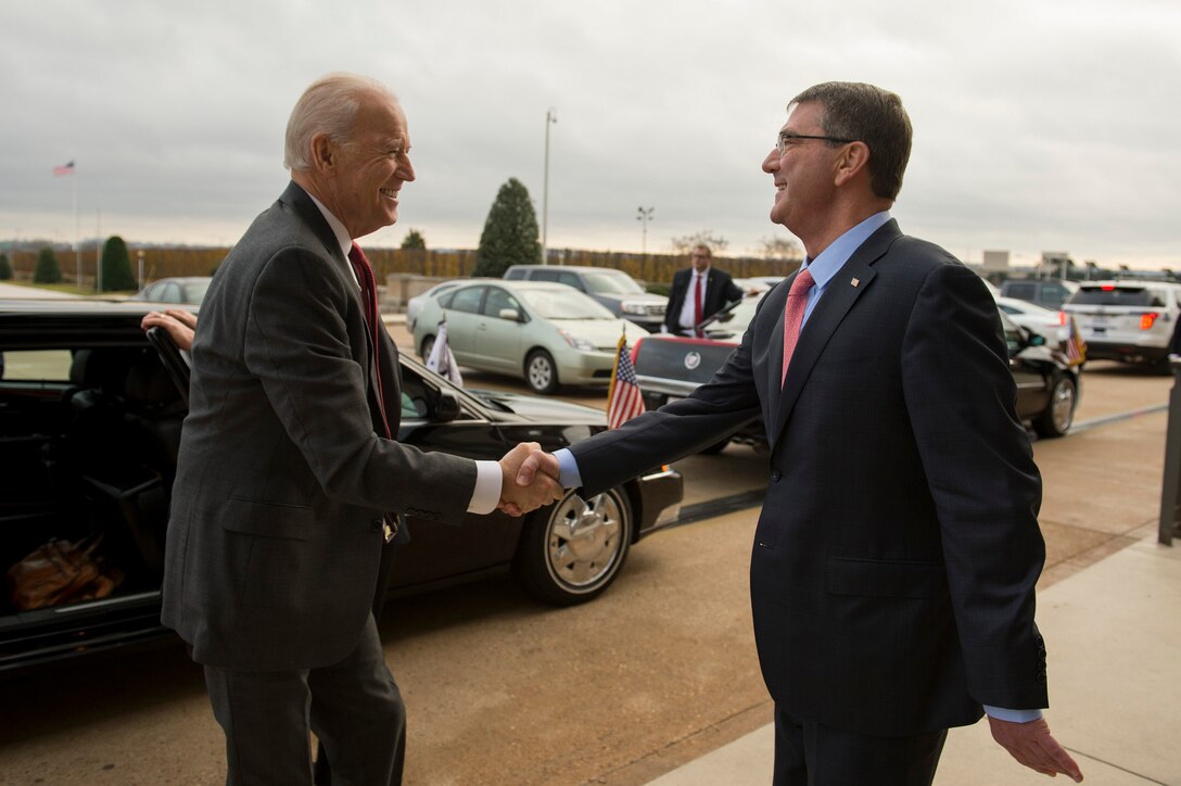 Defense Secretary Ash Carter greets Vice President Joe Biden as he arrives at the Pentagon, Dec. 14, 2015, to meet with the National Security Council about the fight against the Islamic State of Iraq and the Levant, or ISIL. DoD photo by Air Force Senior Master Sgt. Adrian Cadiz