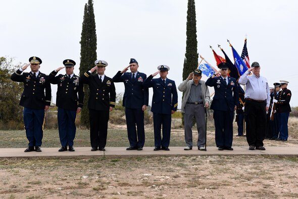 Past and present service members, representing each branch of the military, salute during the Wreaths Across America at the Belvedere Cemetery in San Angelo, Texas, Dec. 12, 2015. The salute was to honor deceased veterans. (U.S. Air Force photo by Airman Chase Sousa/Released)