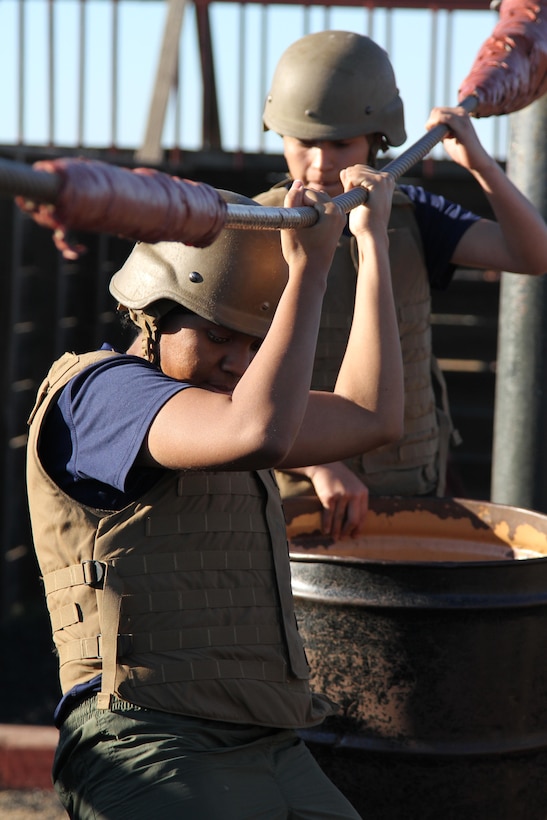Marine enlistees conduct an obstacle, requiring teamwork and strategic planning during a pool function at Weapons Field Training Battalion, Marine Corps Base Camp Pendleton, Calif., Dec. 12, 2015. During the event, recruiters teamed with drill instructors to mentally and physically prepare enlistees from Los Angeles, San Diego and Orange County for boot camp and taught classes about military appearance and Marine Corps history. (U.S. Marine Corps photo by Staff Sgt. Alicia R. Leaders/Released)