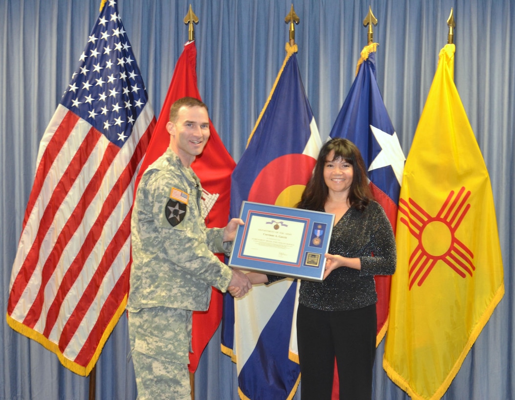 ALBUQUERQUE, N.M. – District Commander Lt. Col. Patrick Dagon recognizes Corrinne Garcia, supervisory budget analyst, as the District’s Supervisor of the Year, Dec. 10, 2015.  