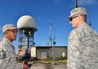 Master Sgt. Morris Niibu, a radio frequency technician for the 169th Air Defense Squadron, shows Col. Randy Huiss, 15th Wing commander, the Federal Aviation Administration’s radar tower during a tour of the Mount Kaala Air Force Station, Hawaii, Dec. 4, 2015. The tour was an opportunity for Huiss to better understand the mission of the 169th ADS and improve the integration with the HIANG and active duty Air Force. (U.S. Air Force photo by Tech. Sgt. Aaron Oelrich/Released)