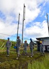 Airmen from the 169th Air Defense Squadron talked to Col. Randy Huiss, 15th Wing commander, and Chief Master Sgt. Jerry Williams, 15th Wing command chief, during a tour of the Mount Kaala Air Force Station, Hawaii, Dec. 4, 2015. With an elevation of roughly 4,000 feet, Mount Kaala Air Force Station is the highest point on the island of Oahu. (U.S. Air Force photo by Tech. Sgt. Aaron Oelrich/Released)