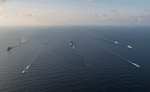 Ships and submarines from the Republic of Singapore navy and U.S. Navy gather in formation during the underway phase of Cooperation Afloat Readiness and Training (CARAT) Singapore 2015. CARAT is an annual, bilateral exercise series with the U.S. Navy, U.S. Marine Corps and the armed forces of nine partner nations. (U.S. Navy photo by Mass Communication Specialist 2nd Class Joe Bishop/Released)