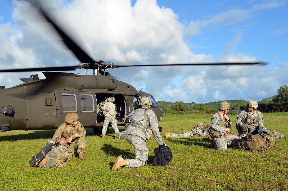 Army Lt. Col. Ryan O'Connor, far right, leads his soldiers during a mock air assault on Marine Corps Training Area Bellows, Hawaii, Dec. 2, 2015. O'Connor is commander of the 25th Infantry Division's Company B, 2nd Battalion, 35th Infantry Regiment, 3rd Brigade Combat Team. U.S. Army photo by Staff Sgt. Armando Limon