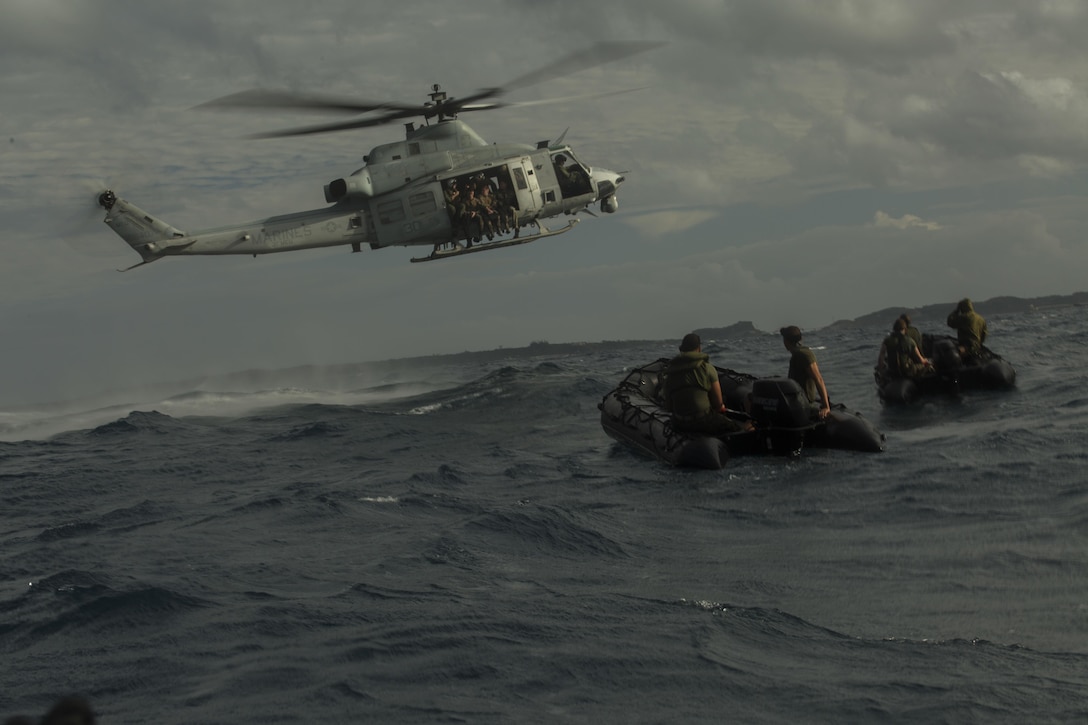 Marines with the Maritime Raid Force, 31st Marine Expeditionary Unit, prepare to jump from a UH-1Y Huey during helocast training at Kin Blue, Okinawa, Japan, Dec. 2, 2015. Once the Marines jumped into the water, they swam to the waiting Combat Rubber Raiding Craft which brought them to shore. 