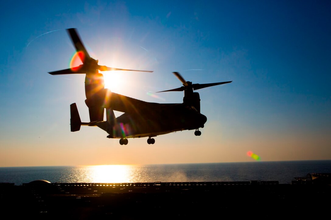 A U.S. Marine Corps MV-22 Osprey with Marine Medium Tiltrotor Squadron 268, Special Purpose Marine Air Ground Task Force-Crisis Response-Central Command, prepares to land aboard the USS Kearsarge during carrier qualification training in the Arabian Gulf, Dec. 11, 2015. VMM-268 conducted the training with VMM-162 (REIN), 26th Marine Expeditionary Unit, to certify 10 pilots and 11 crew chiefs to conduct aviation operations from sea-based sites. SPMAGTF-CR-CC is currently deployed in the U.S. Central Command area of responsibility with a crisis response mission spanning 20 nations.