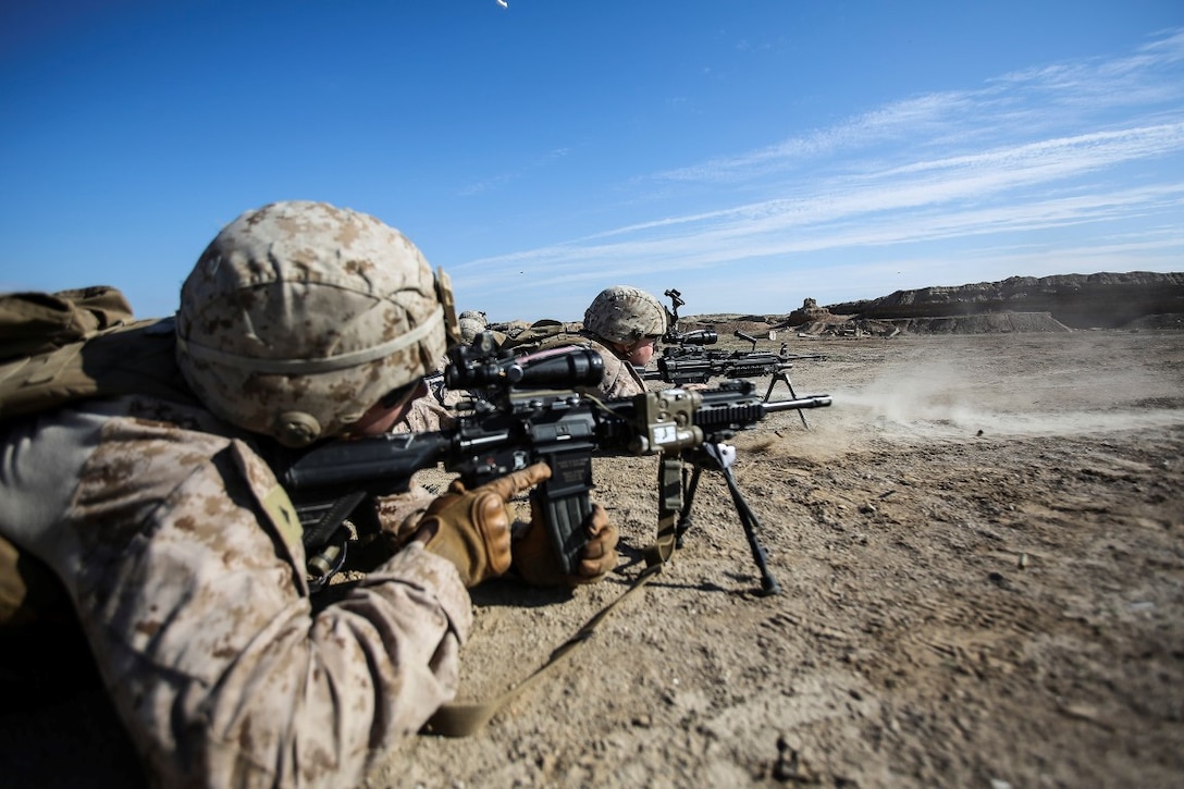 U.S. Marines with Bravo Company, 1st Battalion, 7th Marine Regiment, Special Purpose Marine Air Ground Task Force – Crisis Response – Central Command, fire M249 and M240B machine guns during a battle sight zero range at Al Taqaddum, Iraq, Dec. 2, 2015. As part of the security force, SPMAGTF-CR-CC Marines continuously hone their marksmanship skills, enabling building partner capacity training and operations within Combined Joint Task Force - Operation Inherent Resolve. Operation Inherent Resolve aims to enable and equip indigenous forces to defeat ISIL while leveraging U.S. and coalition nation airpower to halt the terrorist’s momentum. 