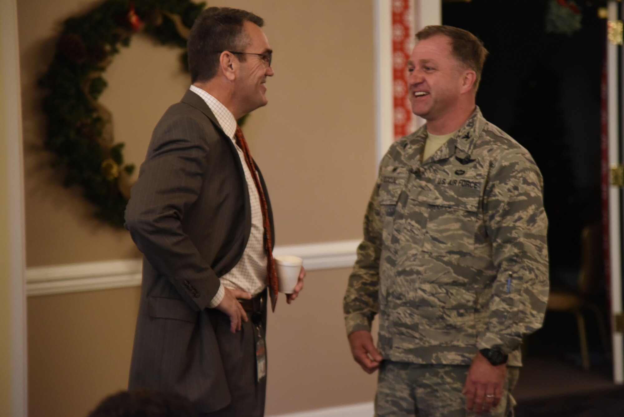 Dr. Michael Dunsmore (left), Wayne County Public Schools superintendent, and Col. Mark Slocum, 4th Fighter Wing commander, talk prior to the annual WCPS principals’ meeting, Dec. 9, 2015, at Seymour Johnson Air Force Base, North Carolina. At the conclusion of the meeting, the principals were given a tour of the base to get an inside look at where and how military children live. (U.S. Air Force photo/Senior Airman Brittain Crolley)