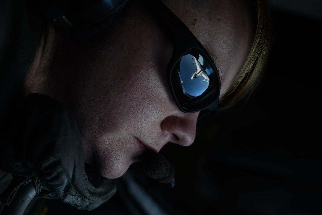 Senior Airman Sonya Alexander, 77th Air Refueling Squadron boom operator, provides fuel to an E-3 Sentry (AWACS) aircraft during Exercise Razor Talon, Dec. 14, 2015, over the coast of North Carolina. The AWACS is a modified Boeing 707/320, which provides command and control battle management for ally aircraft. (U.S. Air Force photo/Senior Airman John Nieves Camacho)