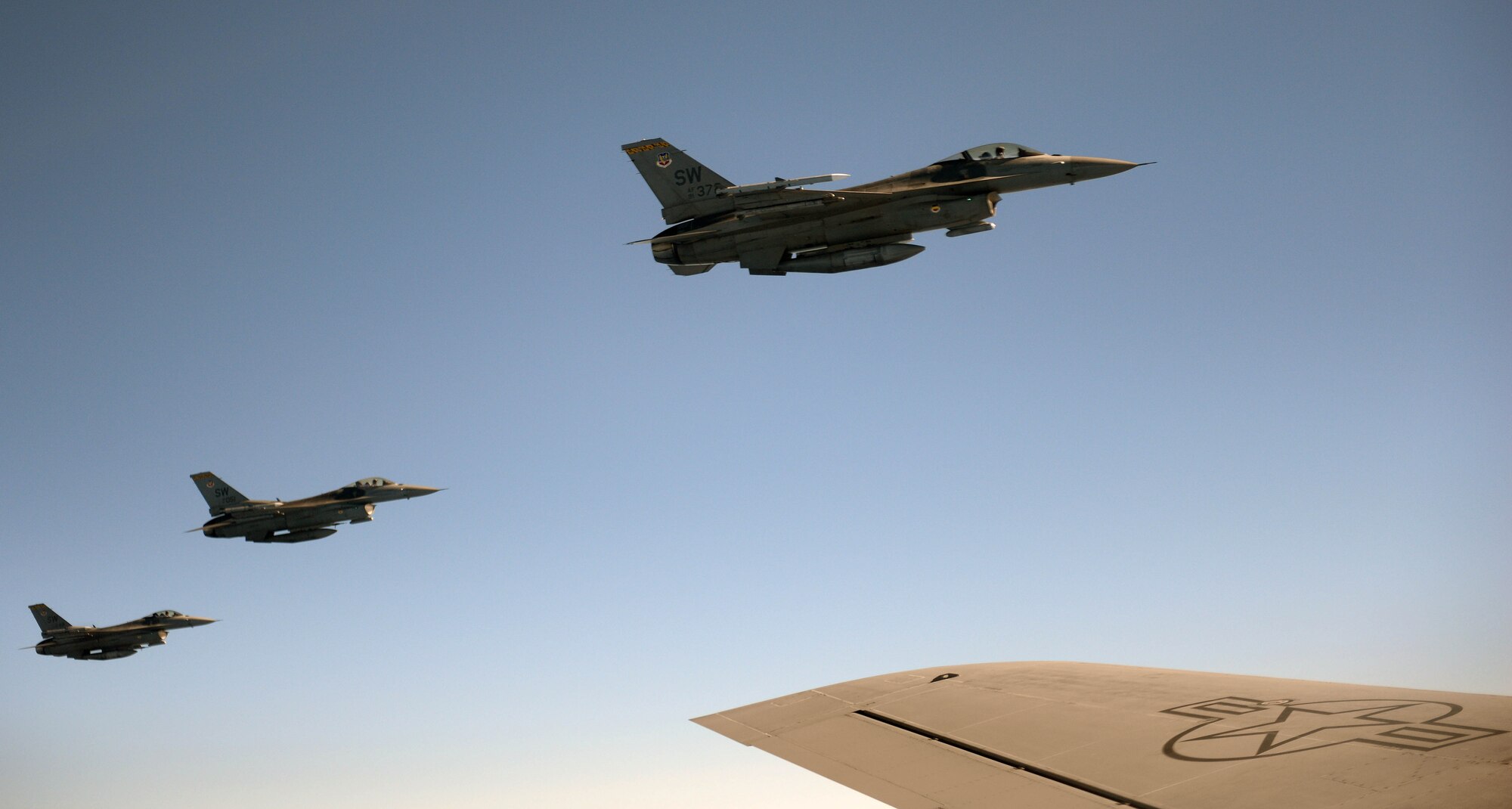 Three F-16 Fighting Falcon aircraft fly beside a KC-135R Stratotanker during Exercise Razor Talon, Dec. 14, 2015, over the coast of North Carolina. The F-16 is a compact, multi-role fighter aircraft that provides a relatively low-cost, high-performance weapon system for the United States and allied nations. (U.S. Air Force photo/Senior Airman John Nieves Camacho)