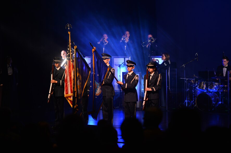 The Bellevue East High School Reserve Officer Training Corps posts the colors to begin the United States Air Force Heartland of America Band’s 2015 holiday concert tour on Dec. 12 at Bellevue East High School in Bellevue, Neb.  The “Sounds of the Season” holiday tour visits several Omaha area schools over a three-week period, performing in front of thousands of concert goers. (U.S. Air Force photo by Josh Plueger)