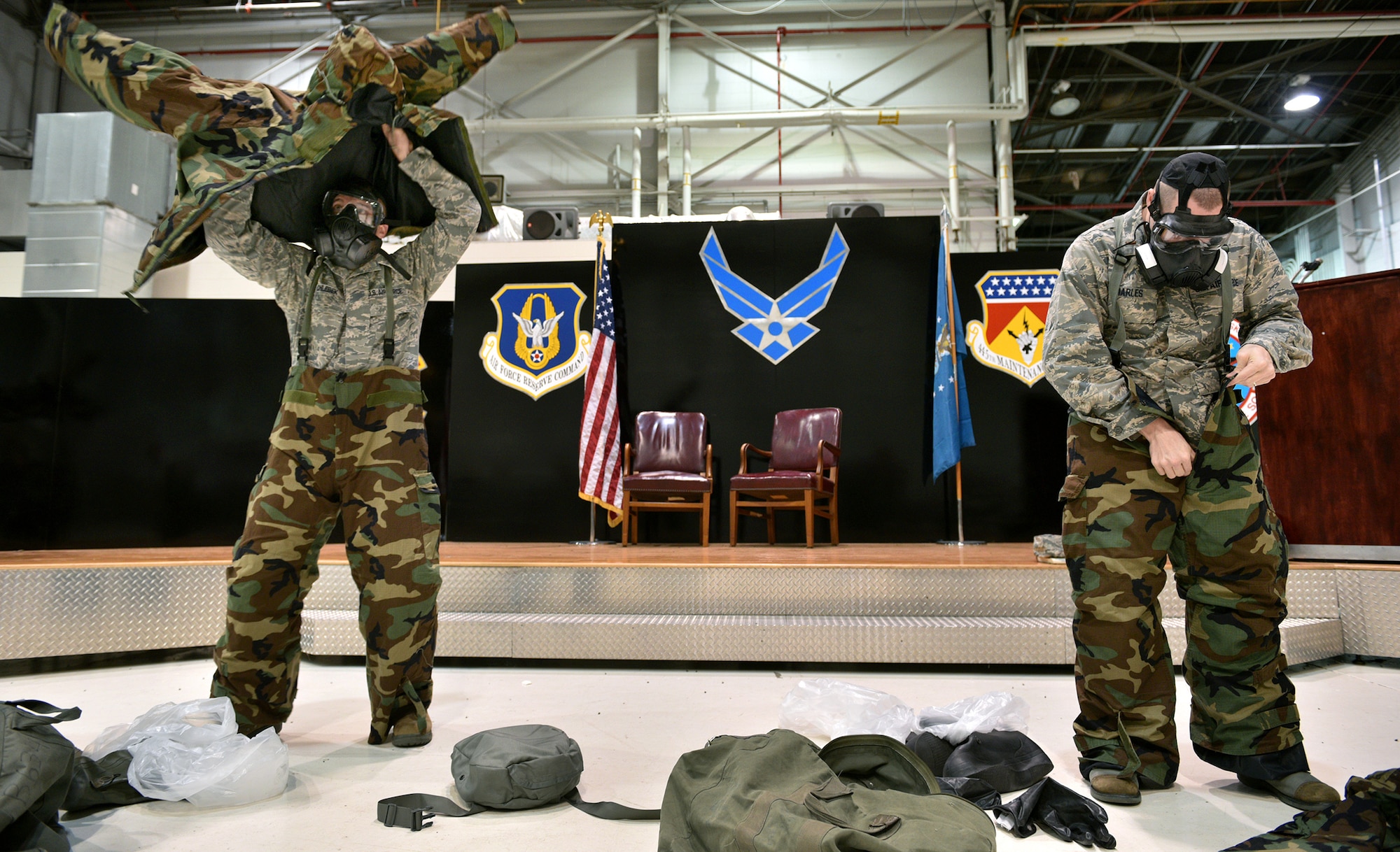 WRIGHT-PATTERSON AIR FORCE BASE, Ohio - Tech. Sgt. Joseph Chlebek and 2nd Lt. Jonathan Charles, both with the 445th Aeromedical Staging Squadron, race against the clock to don their chemical warfare gear during the Nov. 15, 2015 unit training assembly. The pair competed in a warrior challenge that tests skills found in the Airman’s Manual. (U.S. Air Force photo/Tech. Sgt. Frank Oliver) 