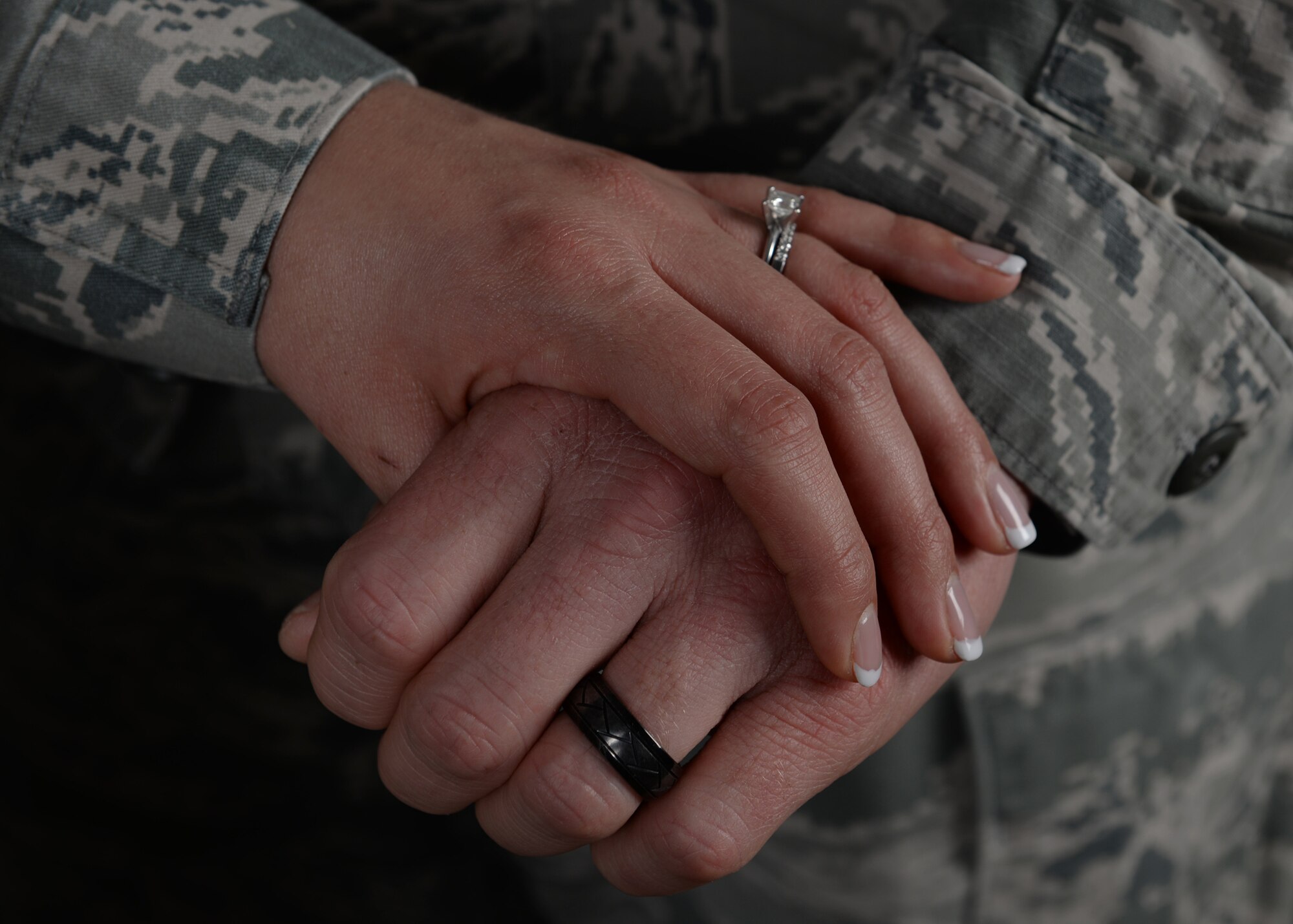 Tech. Sgts. Lillian and Gideon Stibor, 28th Medical Operations Squadron dental records NCO in charge and 28th Logistics Readiness Squadron fuels distribution NCOIC, show their wedding rings at Ellsworth Air Force Base, S.D., Dec. 9, 2015. Although the stress and schedules of being military training instructors conflicted with spending quality time together, the Stibor’s managed to make it work. (U.S. Air Force Airman 1st Class Denise M. Nevins/Released)