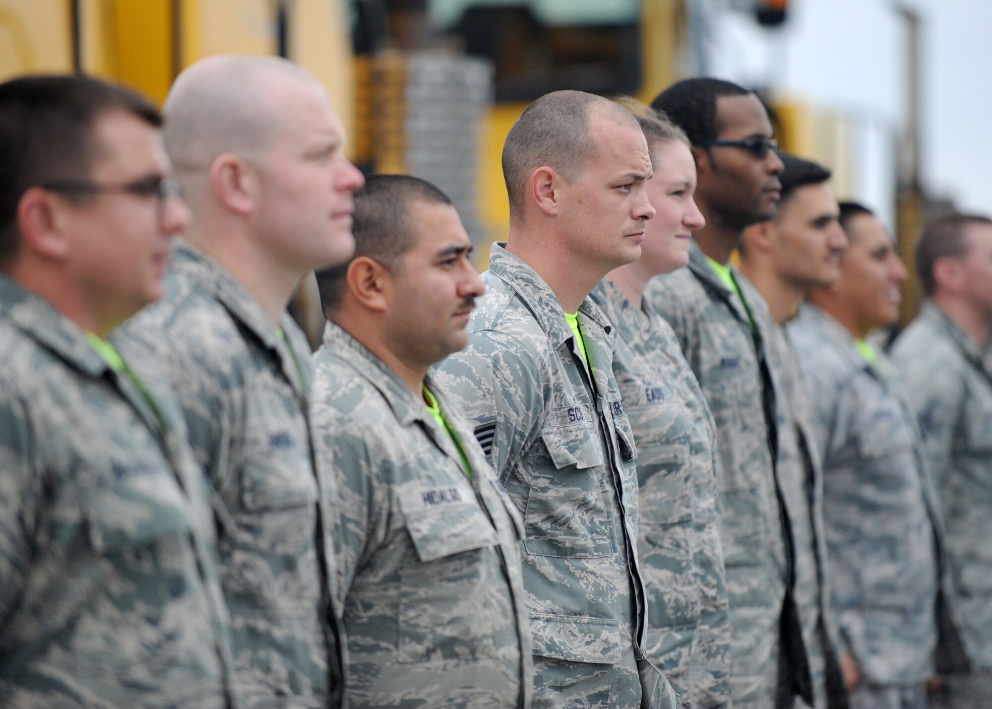 Members of the 436th Civil Engineer Squadron wait to escort wing leadership to snow removal vehicles during the annual snow parade Nov. 6, 2015, at Dover Air Force Base, Del. The snow parade allowed commanders the opportunity to learn about the snow removal process and vehicles. (U.S. Air Force photo/Tech. Sgt. Elizabeth Morris)